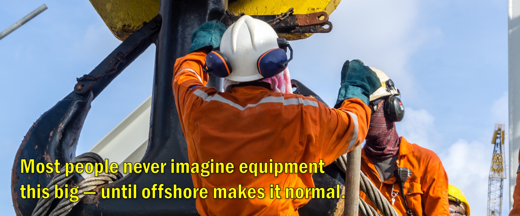 Offshore riggers attaching slings during a heavy lift crane operation