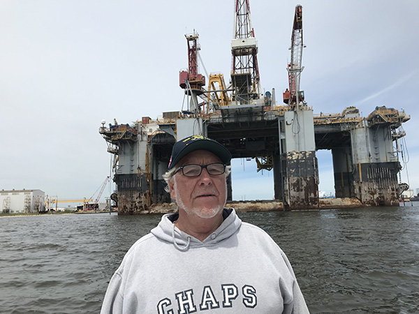 cpt ron in front of oil rig